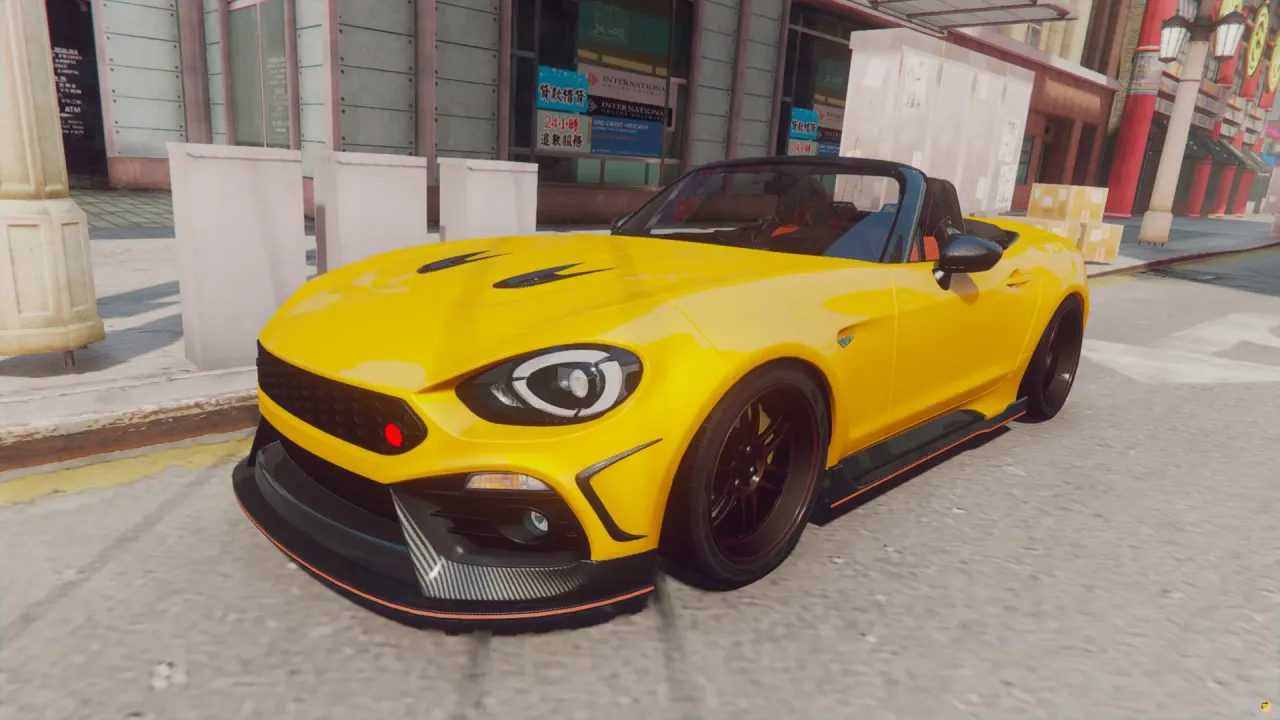 Fiat 124 Spider 2017 FiveM roadster in yellow with a carbon splitter, front three-quarter view on a city street