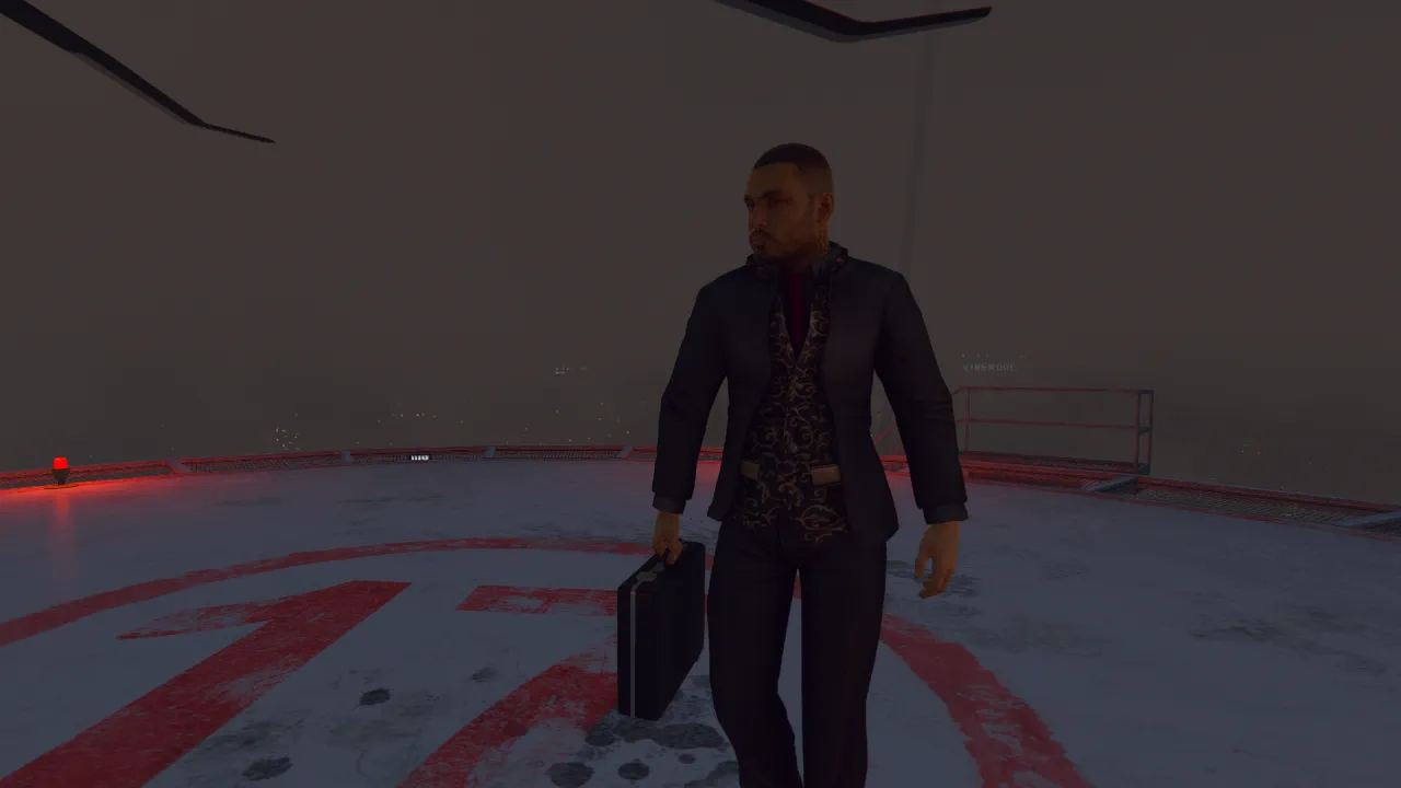 Vagos ped in a dark suit and patterned shirt carries a briefcase across a rooftop helipad in FiveM