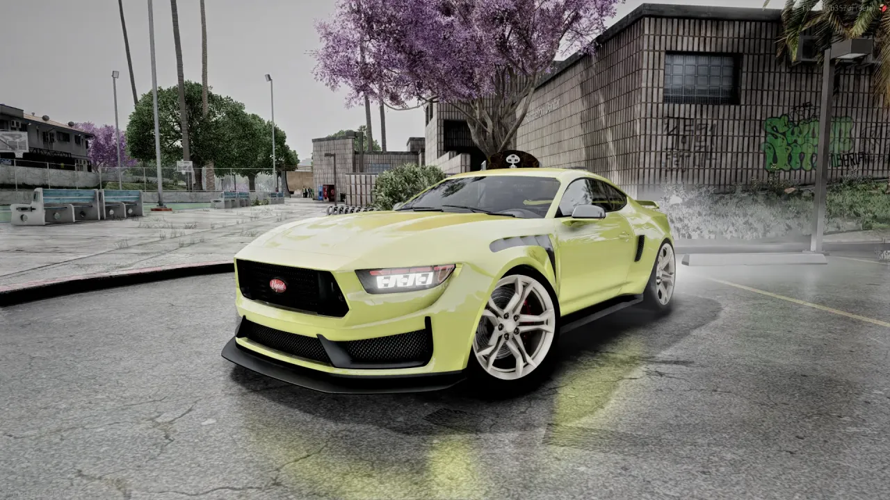 Vapid Dominator Black GT 24 in pale yellow with silver wheels, front three-quarter view by a graffiti wall