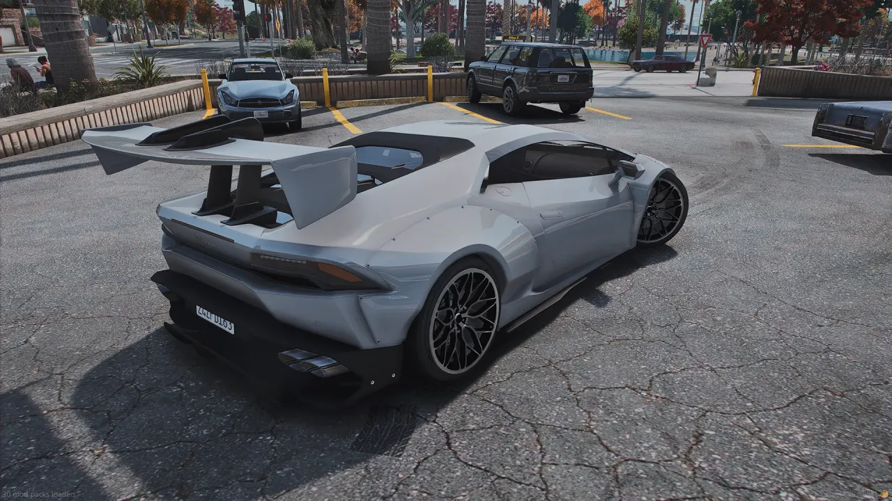 Pegassi Tempesta TTS in grey with a large rear wing, high rear three-quarter view in a sunny parking lot