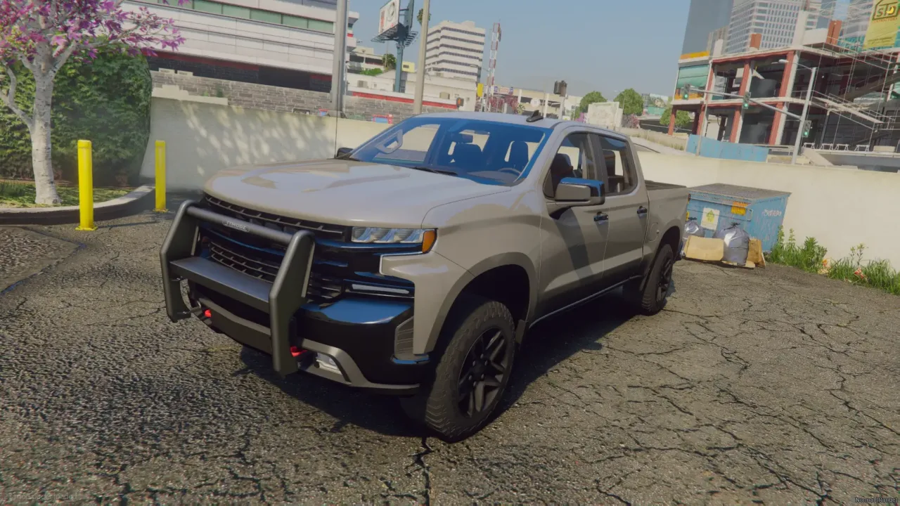 Chevrolet Silverado 2020 FiveM pit pickup in grey with a push bar on cracked asphalt
