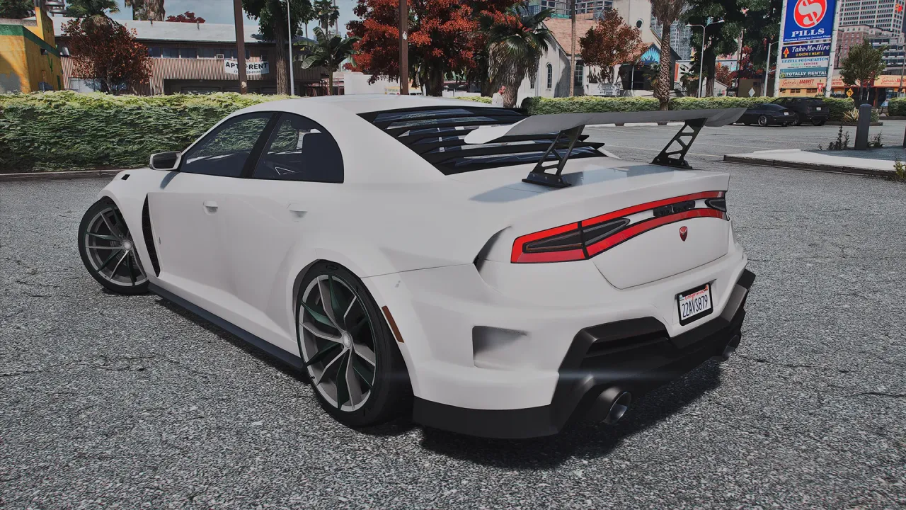 Bravado Buffalo TTS 15 in white with a tall rear wing and red light bar, rear three-quarter view on asphalt