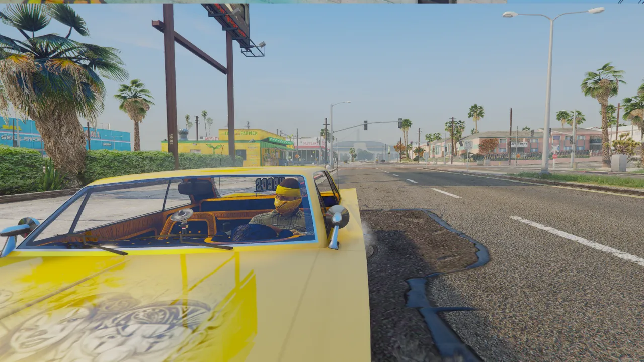 Vagos ped in a yellow bandana sits behind the wheel of a lowrider with the door open on a palm-lined FiveM street