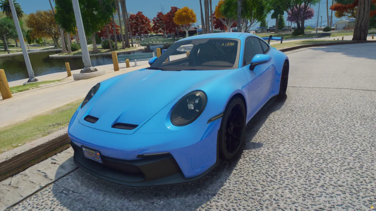 HH GT 322, Porsche 911 FiveM car in light blue with black wheels, front three-quarter by a lakeside park