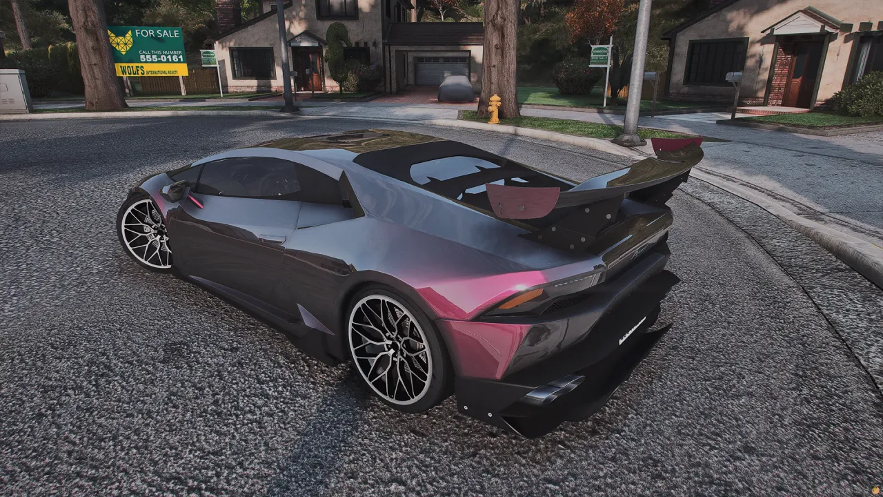 Pegassi Tempesta rear three-quarter view in pink and grey with a rear wing and white spoke wheels on a street