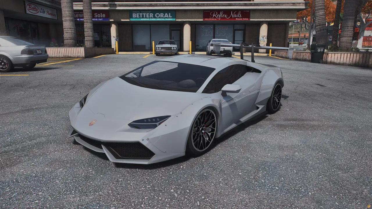 Pegassi Tempesta TTS in light grey with black wheels, front three-quarter view in a strip mall parking lot