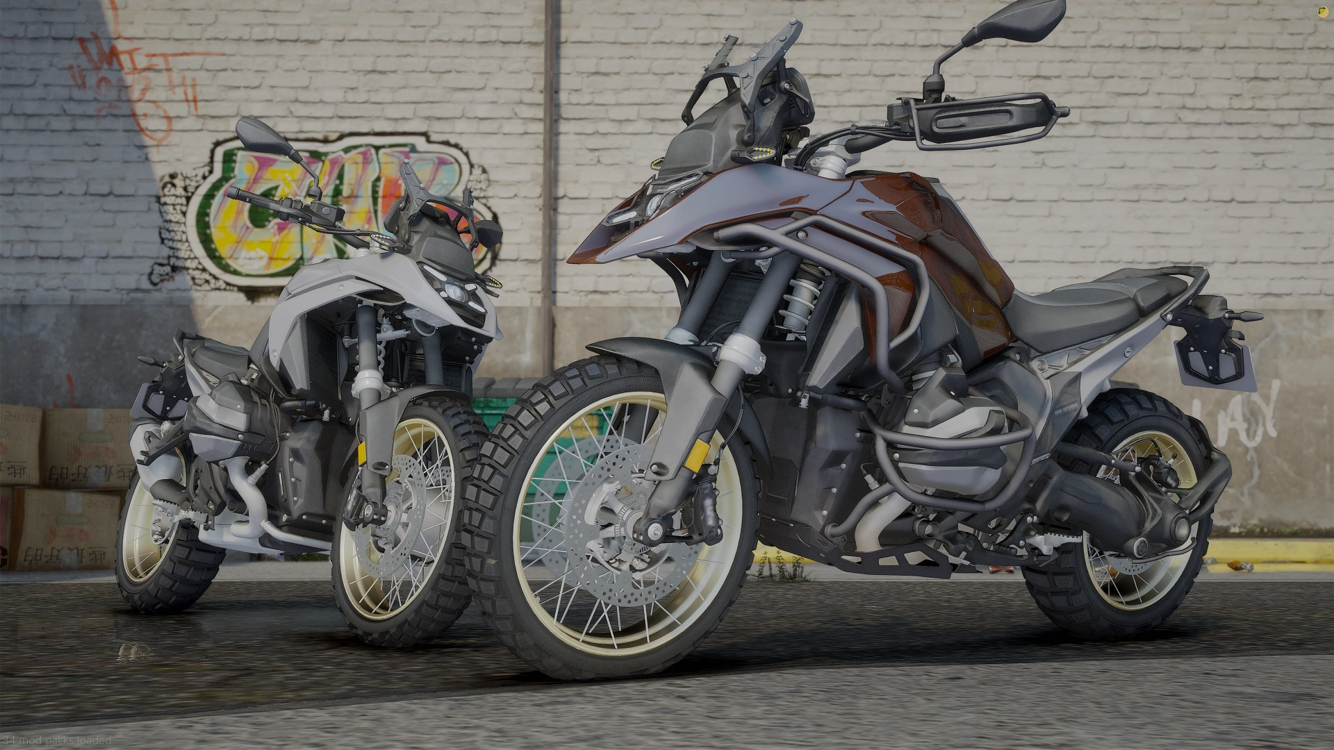 BMW R 1300 GS (2024) FiveM adventure bikes in grey and bronze with gold spoked rims by a graffiti wall