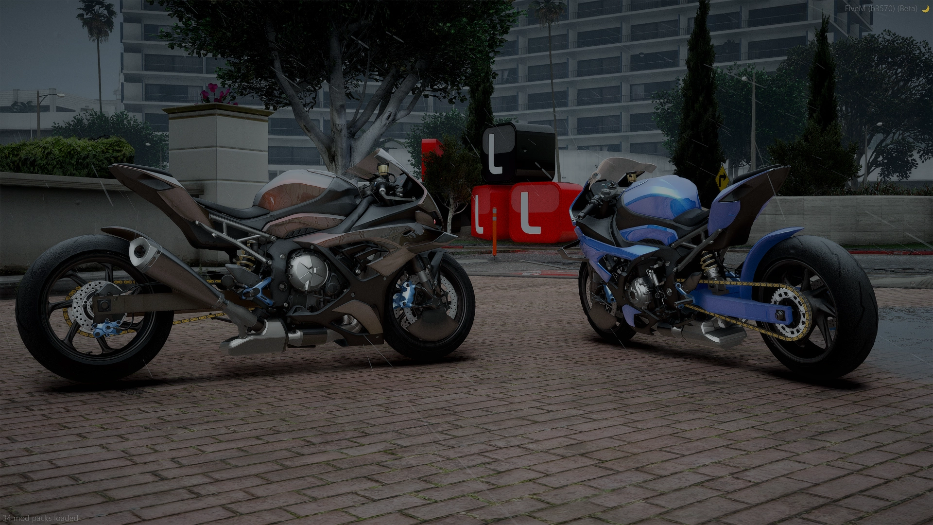 Dark grey and blue BMW M 1000 RR FiveM machines in side profile on a brick courtyard beside a red sign