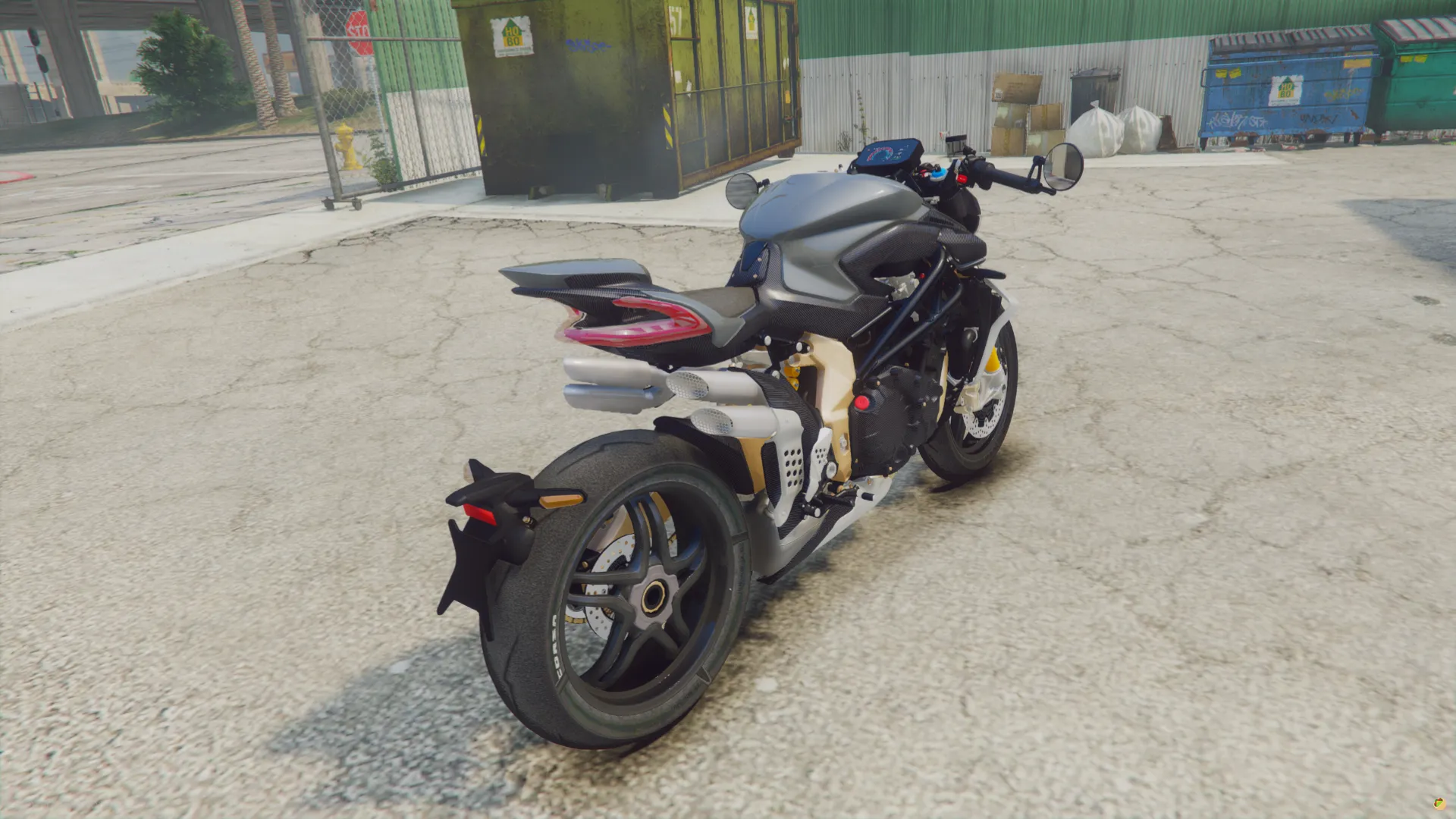 MV Agusta Brutale 1000 RR 2022 rear three-quarter view with grey tank and stacked exhaust near dumpsters