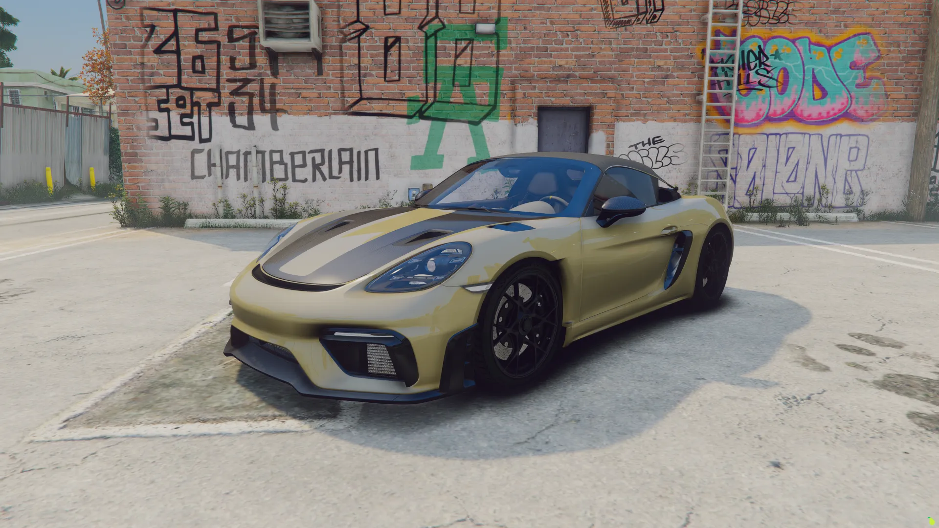 Porsche 718 Spyder RS 2024 FiveM car in gold with black stripes, front three-quarter view by a graffiti wall
