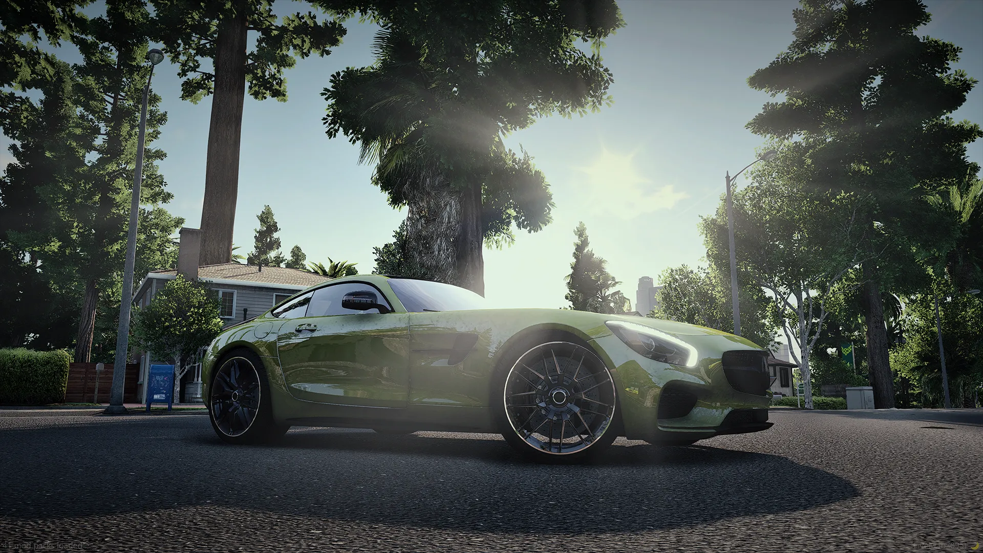 Mercedes-AMG GT (C190) in yellow-green, low side profile on a tree-lined road with sun glare
