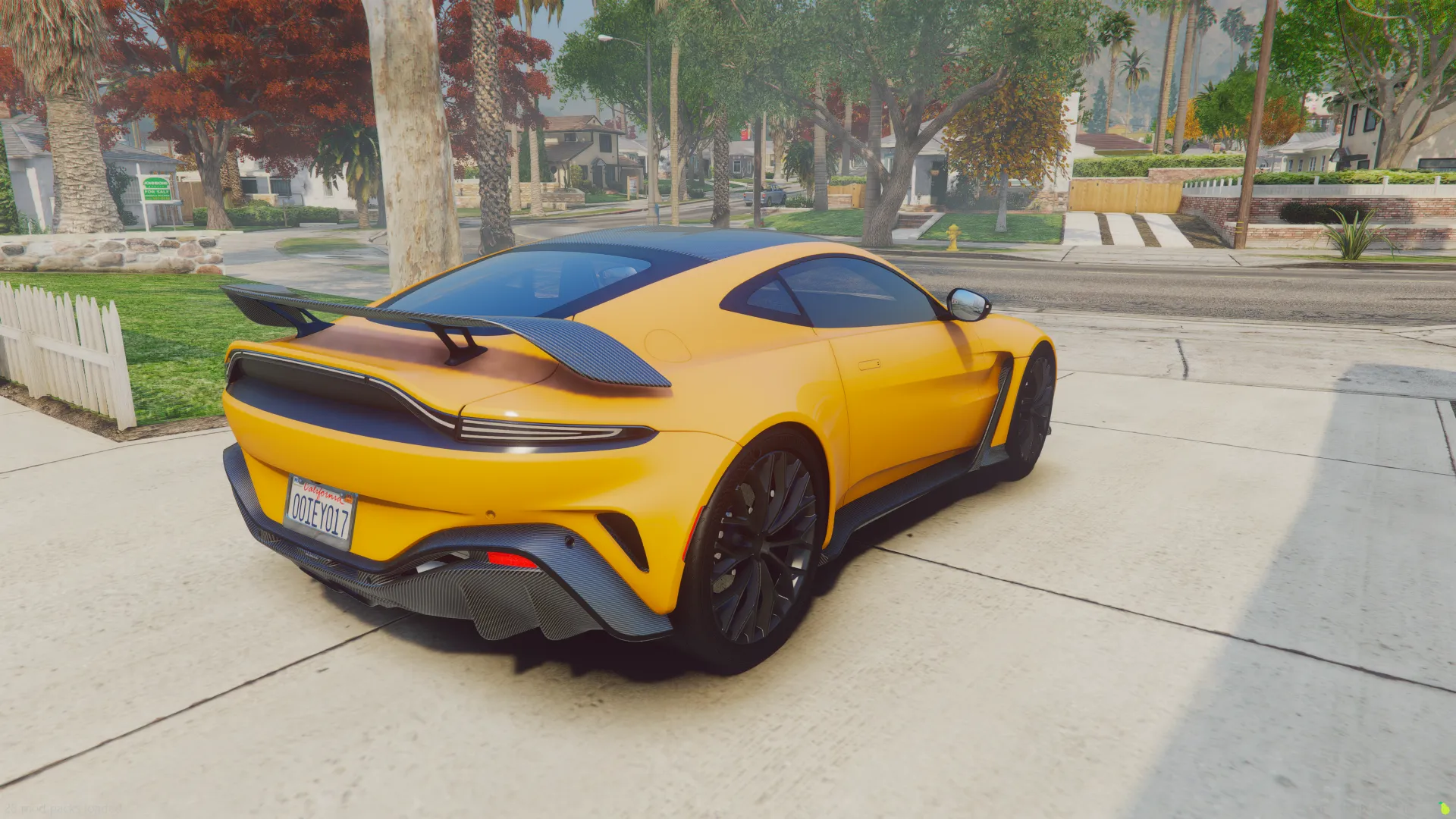 Aston Martin Vantage FiveM model from the rear three-quarter, black ducktail spoiler, palm-lined street