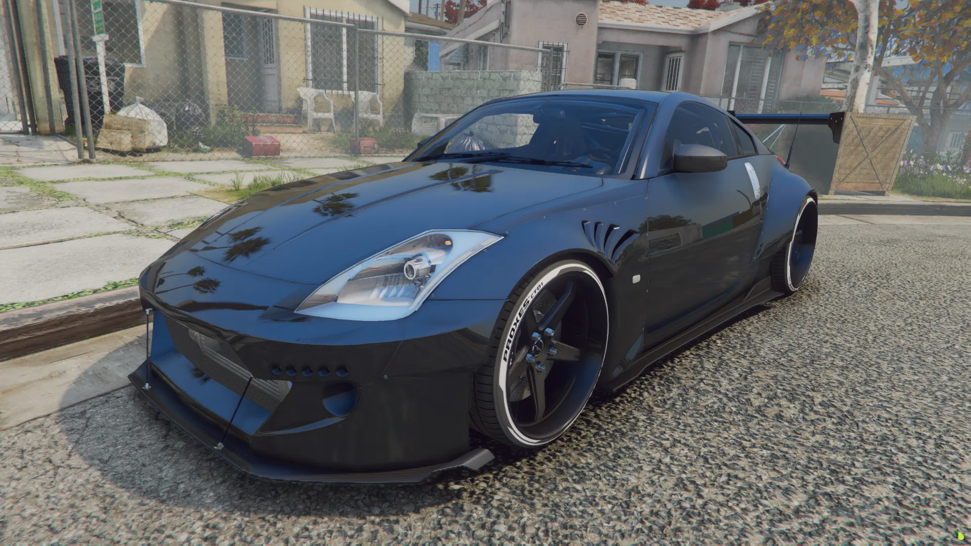 Rocket Bunny - Nissan 350Z FiveM car in gloss black with a widebody kit and white-lettered tires on a suburban street