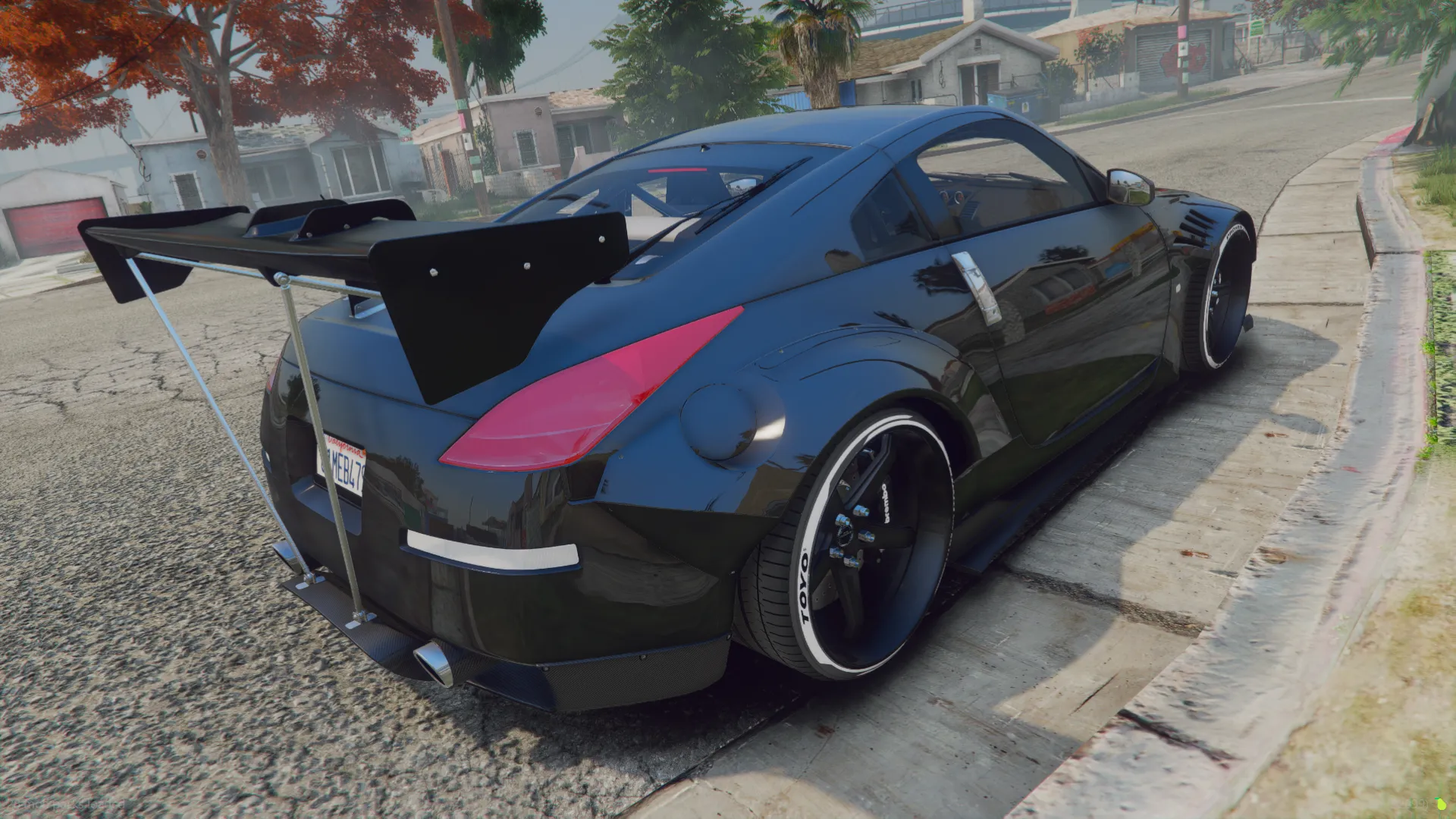 Rocket Bunny - Nissan 350Z rear three-quarter view with a tall strut-mounted rear wing and red taillights